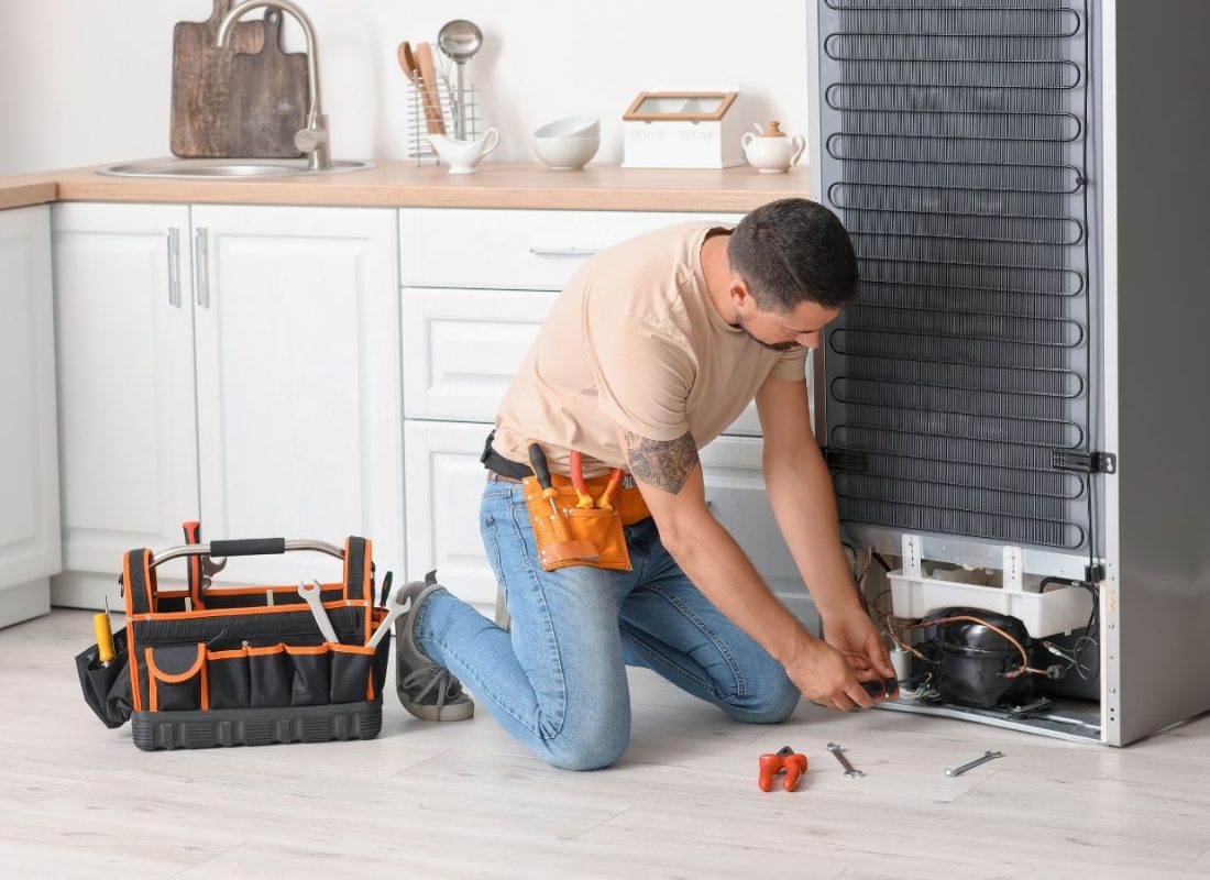Skilled technician testing refrigerator electrical components and airflow with diagnostic equipment. Refrigerator Repair Near Me.