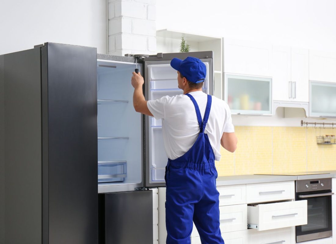 Best Appliance team member performing refrigerator repair in Rancho Cordova, CA showing benefits of hiring a local pro